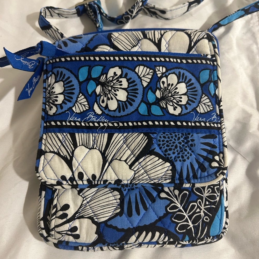 Vera Bradley blue cross body purse.  Approximately 7 inches x 6 inches x 1 inch.